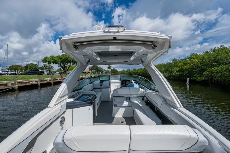 Slide: The Image of 2022 Formula 310 Bowrider OB on a scenic waterway under a blue sky. - 41