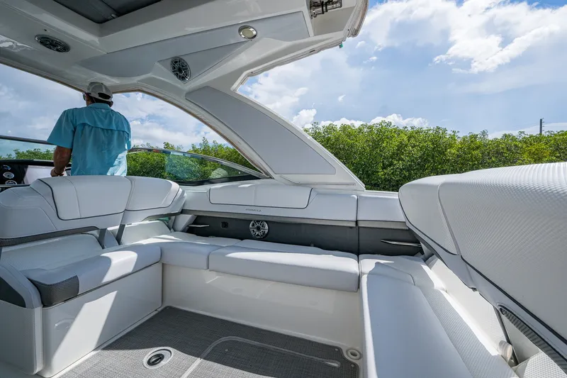 Slide: The Image of 2022 Formula 310 Bowrider OB interior with white seating and modern design. - 45
