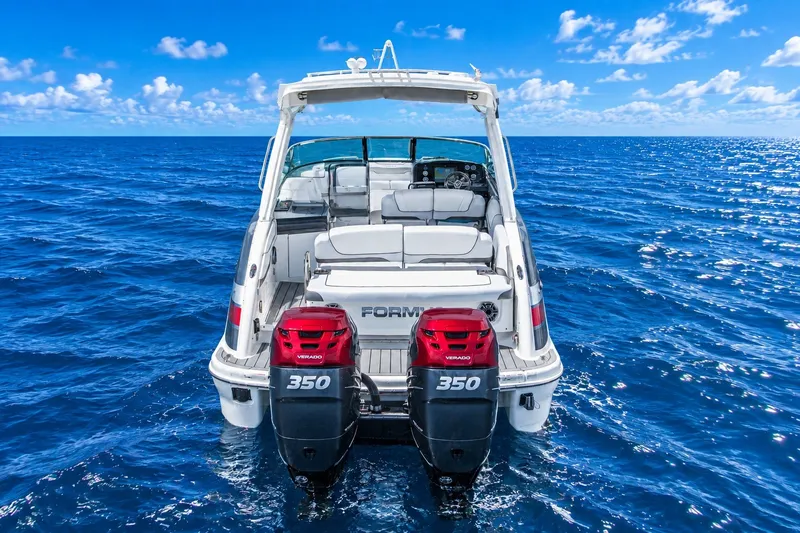 Slide: The Image of 2022 Formula 310 Bowrider OB on open ocean with twin 350 Verado engines. - 2