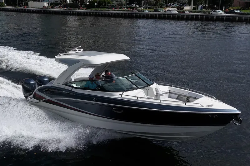 Slide: The Image of 2022 Formula 310 Bowrider OB cruising on water, showcasing sleek design and powerful engines. - 25