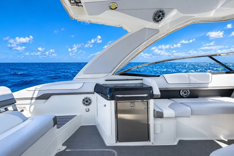 Slide: The Image of 2022 Formula 310 Bowrider OB interior with ocean view, featuring sleek seating and modern amenities. - 10