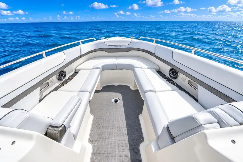 Slide: The Image of 2022 Formula 310 Bowrider OB boat interior with luxurious seating, ocean view. - 7