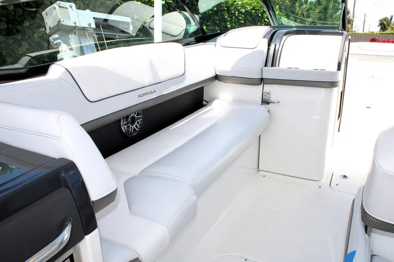 Slide: The Image of 2022 Formula 310 Bowrider OB interior with white seating and sleek design. - 8