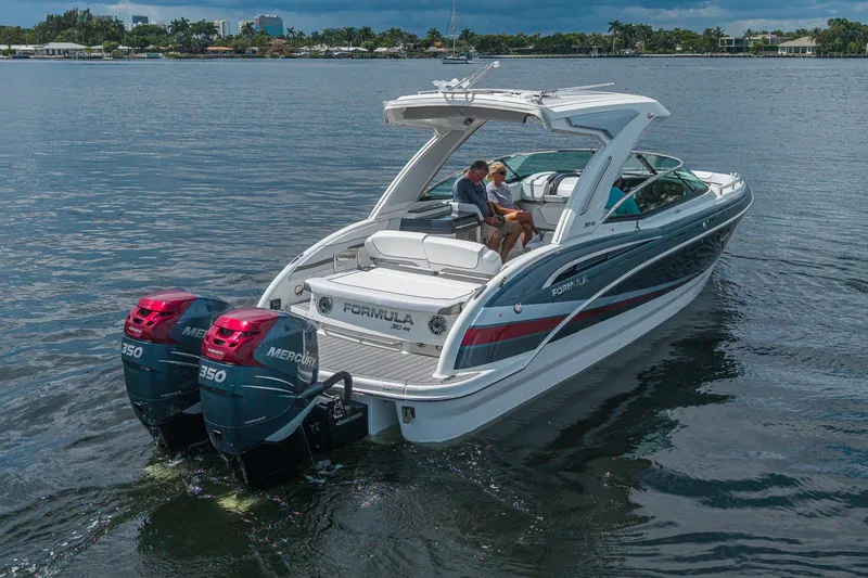 Slide: The Image of 2022 Formula 310 Bowrider OB on water, featuring dual Mercury 350 engines. - 13