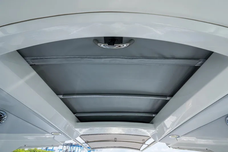 Slide: The Image of 2022 Formula 310 Bowrider OB boat canopy, showcasing sleek design and modern features. - 60
