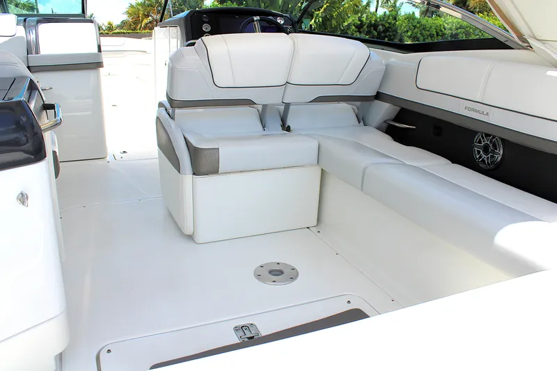 Slide: The Image of 2022 Formula 310 Bowrider OB interior with luxurious white seating and modern design. - 9