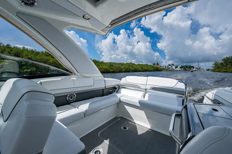 Slide: The Image of 2022 Formula 310 Bowrider OB interior with luxurious seating on a sunny day. - 50
