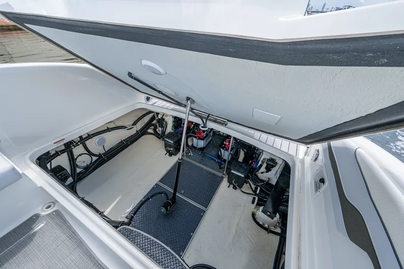 Slide: The Image of 2022 Formula 310 Bowrider OB engine compartment, showcasing clean and organized mechanical layout. - 67