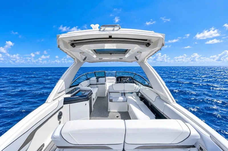 Slide: The Image of 2022 Formula 310 Bowrider OB on open sea, showcasing luxurious seating and sleek design. - 4
