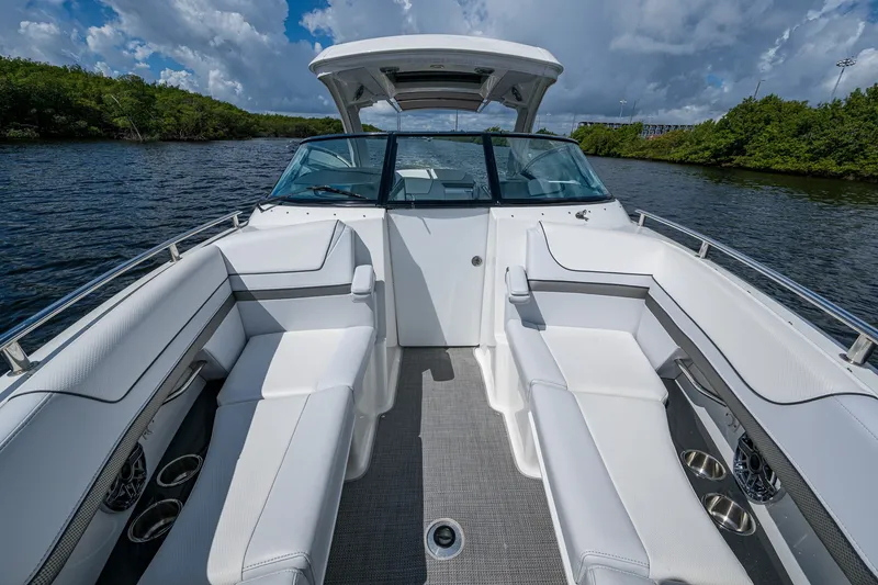 Slide: The Image of 2022 Formula 310 Bowrider OB with spacious seating on a sunny day. - 55
