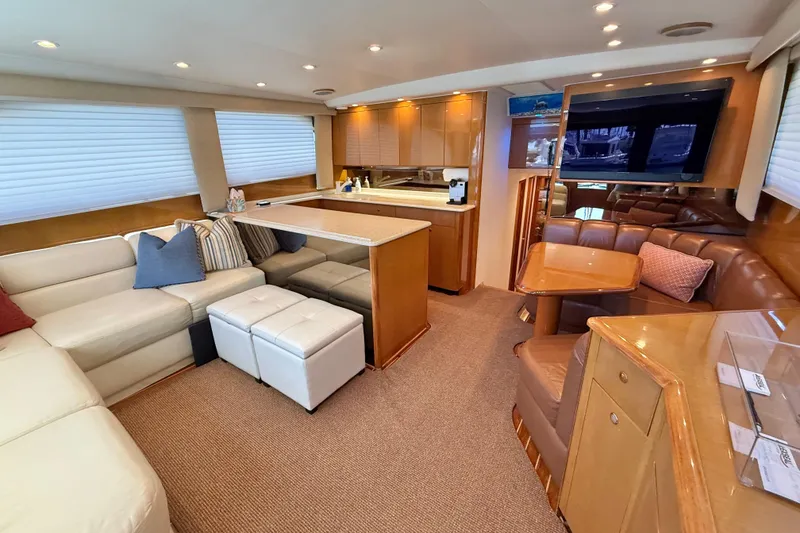 Slide: The Image of Luxurious interior of a 2002 Viking 48 Convertible yacht with modern furnishings. - 23