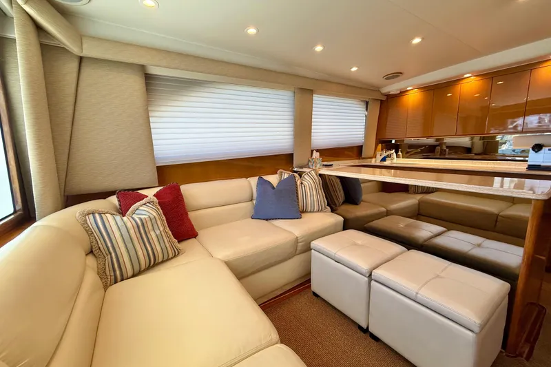 Slide: The Image of Luxurious interior of 2002 Viking 48 Convertible yacht with plush seating and elegant decor. - 25
