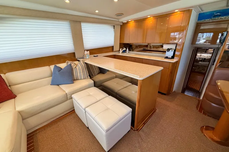 Slide: The Image of Luxurious interior of a 2002 Viking 48 Convertible yacht with modern furnishings. - 26