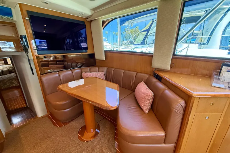 Slide: The Image of Luxurious interior of 2002 Viking 48 Convertible yacht with leather seating and large window. - 27