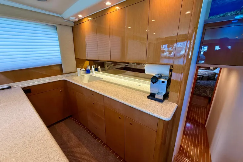 Slide: The Image of Luxurious kitchen interior of 2002 Viking 48 Convertible yacht with modern amenities. - 31
