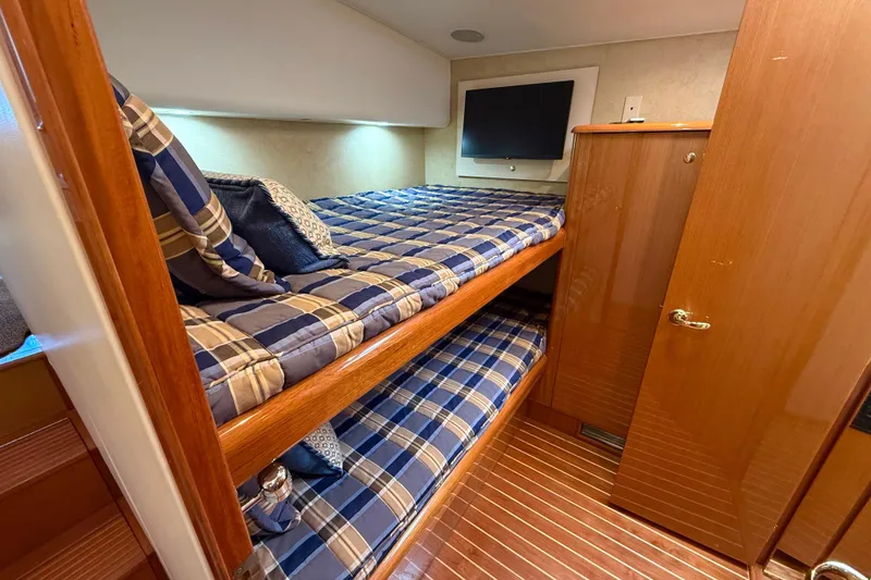 Slide: The Image of Cozy cabin with bunk beds in 2002 Viking 48 Convertible yacht. - 44