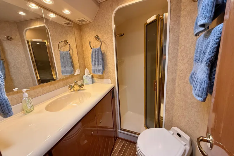 Slide: The Image of Luxurious bathroom in 2002 Viking 48 Convertible yacht with shower and elegant fixtures. - 47
