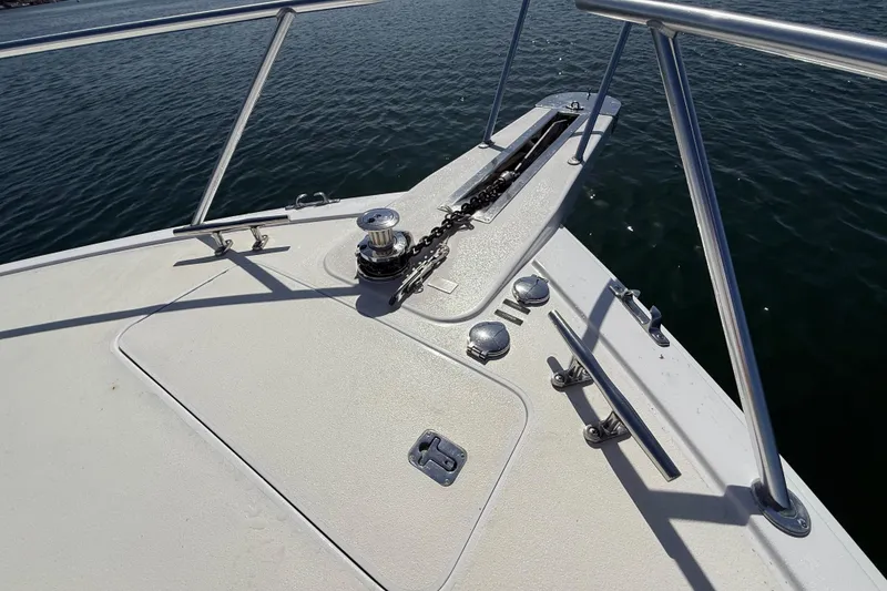 Slide: The Image of Bow of 2002 Viking 48 Convertible yacht with anchor chain and railing. - 54