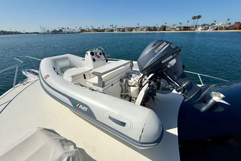 Slide: The Image of Inflatable boat with Yamaha motor on 2002 Viking 48 Convertible yacht deck. - 56
