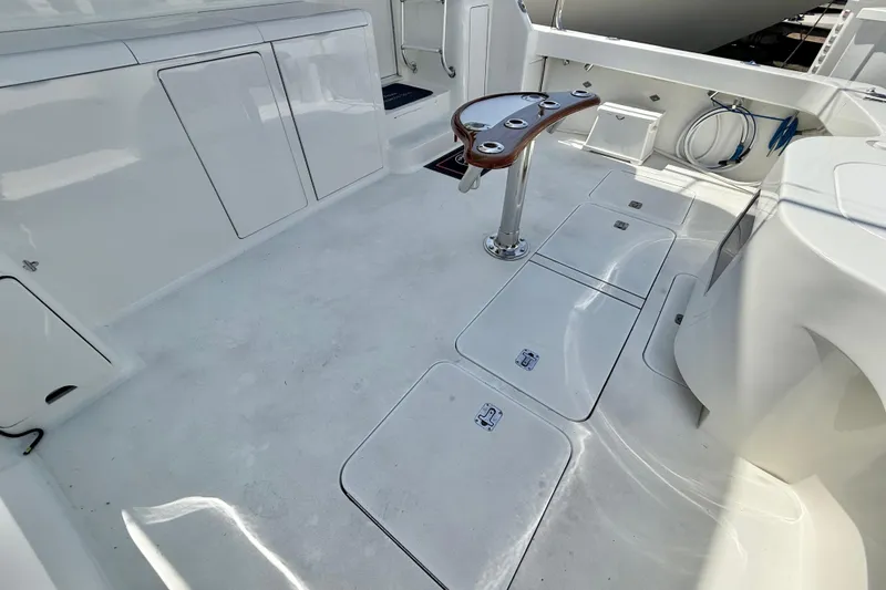 Slide: The Image of Spacious deck of 2002 Viking 48 Convertible yacht with fishing rod holders. - 62