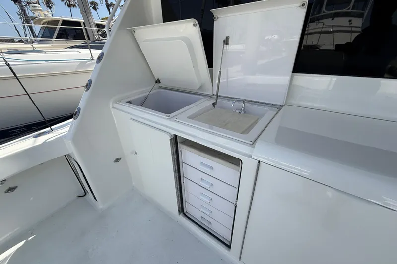 Slide: The Image of 2002 Viking 48 Convertible yacht with outdoor sink and storage drawers. - 68