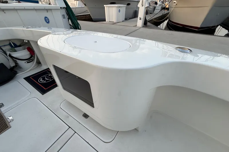 Slide: The Image of 2002 Viking 48 Convertible yacht deck with storage and seating area. - 71