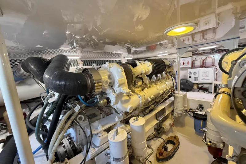 Slide: The Image of Engine room of a 2002 Viking 48 Convertible yacht, showcasing machinery and components. - 79