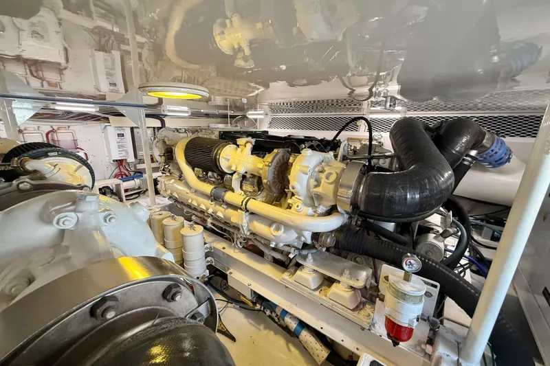 Slide: The Image of Engine room of 2002 Viking 48 Convertible yacht, showcasing detailed machinery and components. - 80
