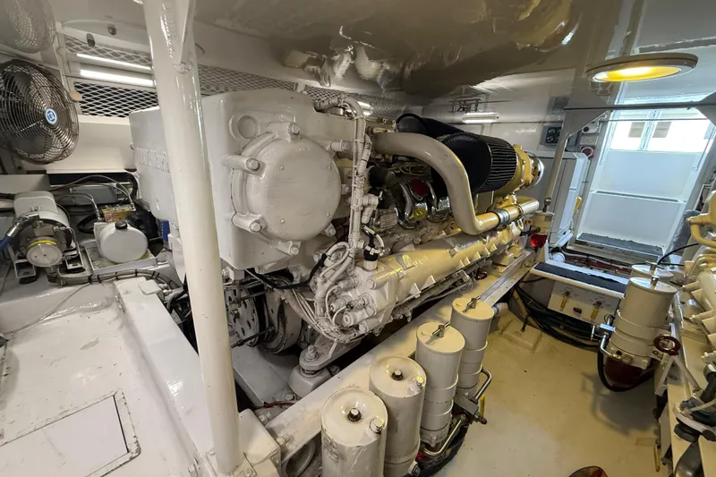 Slide: The Image of Engine room of a 2002 Viking 48 Convertible yacht, showcasing detailed machinery and components. - 81