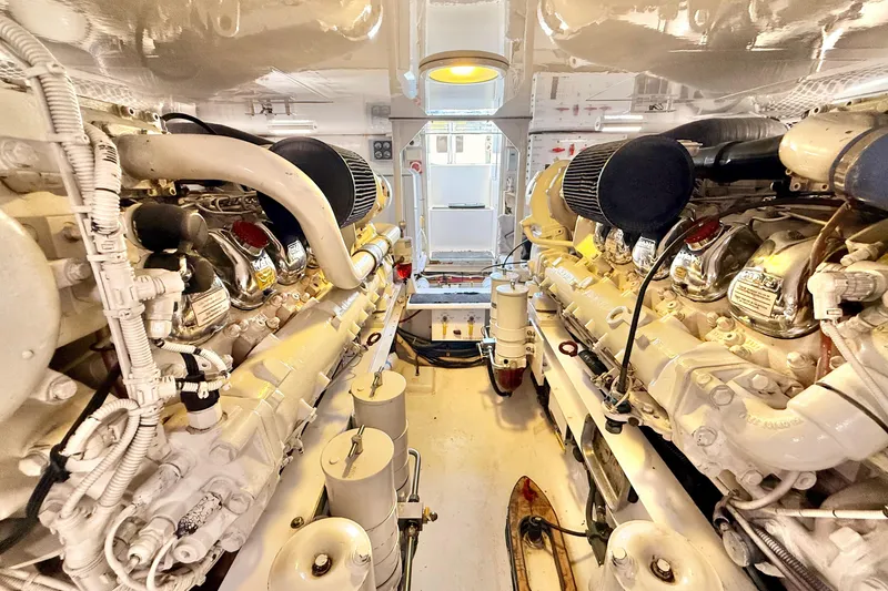 Slide: The Image of Engine room of 2002 Viking 48 Convertible yacht, showcasing dual powerful engines. - 82