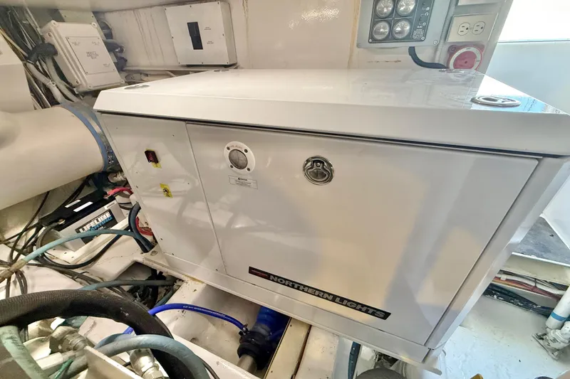Slide: The Image of Engine room of 2002 Viking 48 Convertible with Northern Lights generator. - 83