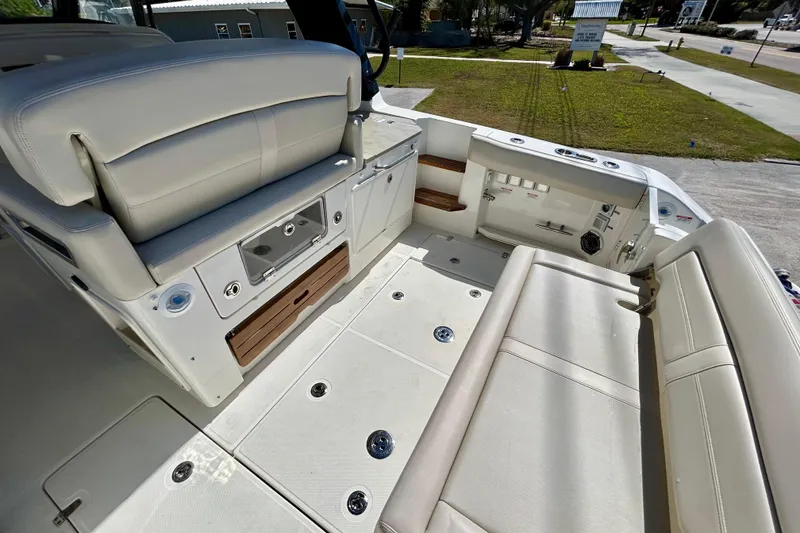 Slide: The Image of 2023 Boston Whaler 350 Realm interior with luxurious seating and modern amenities. - 10