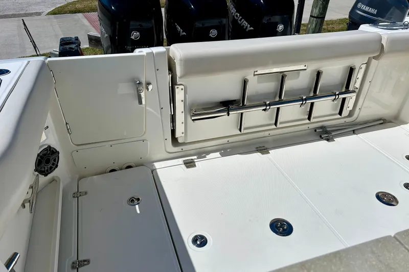 Slide: The Image of 2023 Boston Whaler 350 Realm boat interior with storage and seating features. - 5