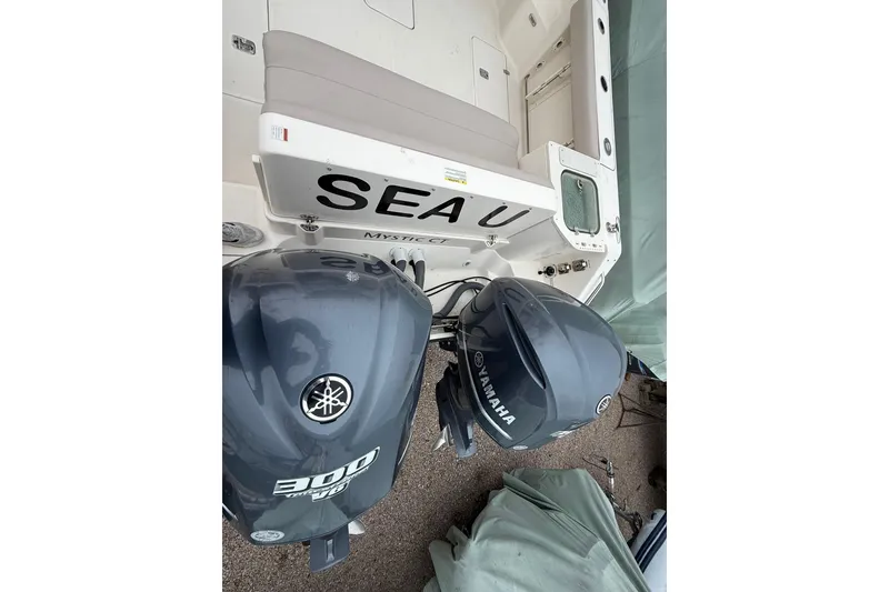 Slide: The Image of 2012 Pursuit OS 315 Offshore boat with twin Yamaha 300 V6 engines, rear view. - 5