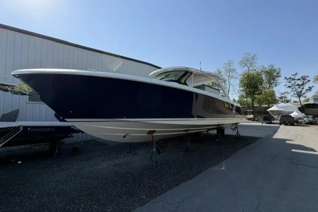 The Image of 2022 Tiara Yachts 43 LS, sleek design, docked outdoors, sunny day. - 0