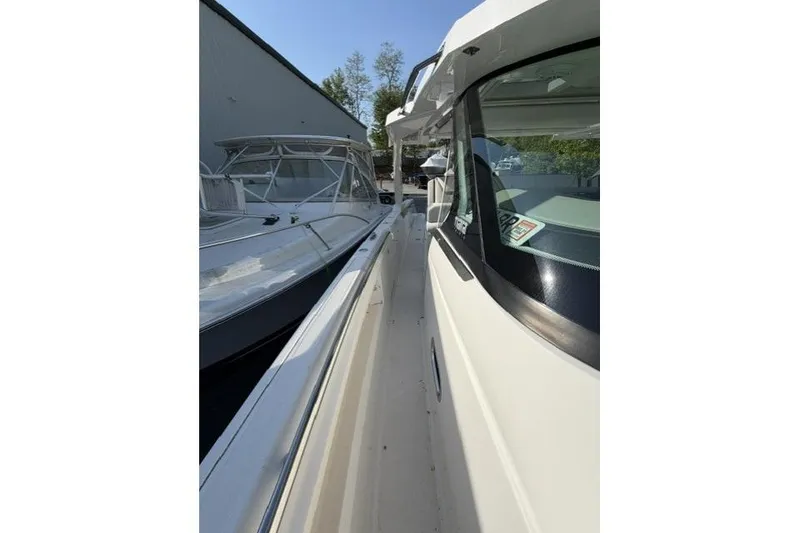 Slide: The Image of 2022 Tiara Yachts 43 LS side view, showcasing sleek design and modern features. - 14