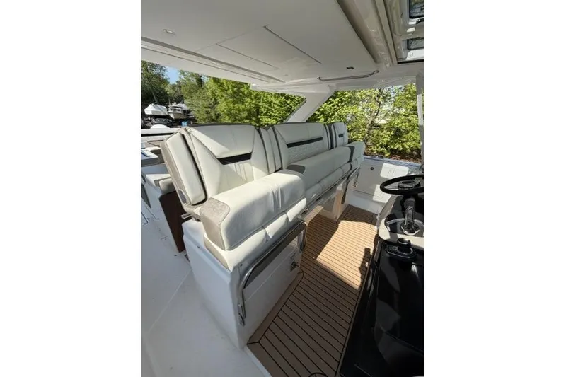 Slide: The Image of Interior of 2022 Tiara Yachts 43 LS, featuring luxurious seating and sleek design. - 7