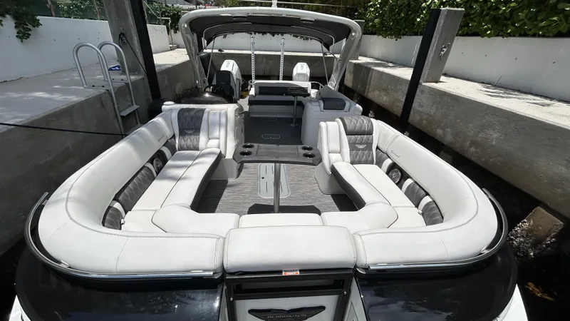 Slide: The Image of 2024 Bennington QX Line pontoon boat with luxurious seating and modern design. - 18