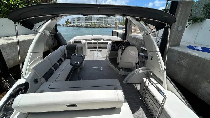 Slide: The Image of 2024 Bennington QX Line luxury pontoon boat with spacious seating and modern design. - 21