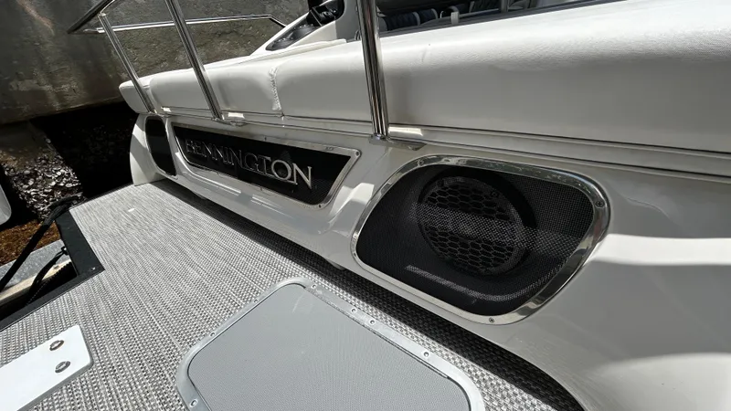 Slide: The Image of 2024 Bennington QX Line boat deck with speaker and logo. - 22