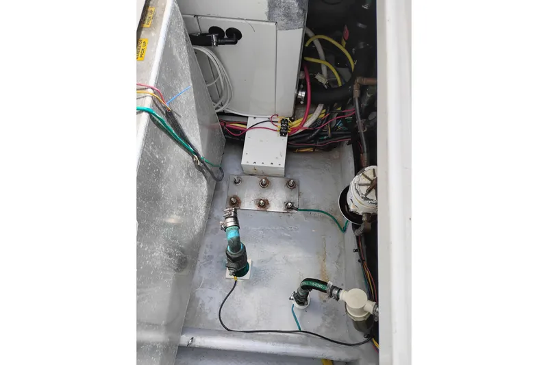 Slide: The Image of Engine compartment of a 2005 Silverton 38 Convertible boat, showing wiring and components. - 11