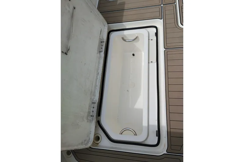 Slide: The Image of Open hatch on 2005 Silverton 38 Convertible boat deck, showing storage compartment. - 12