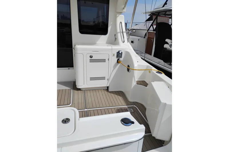 Slide: The Image of 2005 Silverton 38 Convertible yacht deck with storage and power connection. - 13