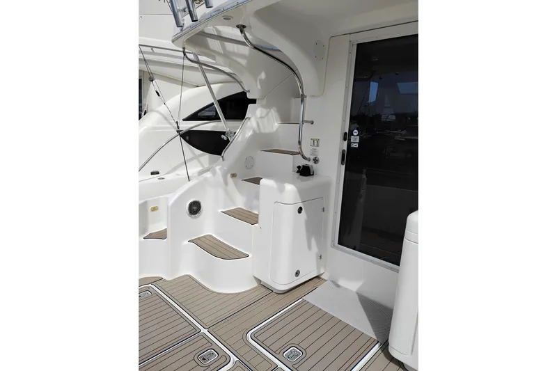 Slide: The Image of 2005 Silverton 38 Convertible yacht interior with sleek white design and wooden accents. - 18