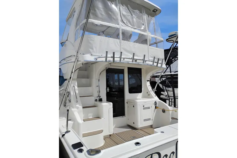 Slide: The Image of 2005 Silverton 38 Convertible yacht with spacious deck and elegant design. - 2