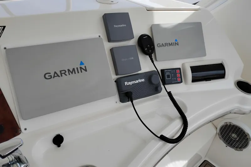 Slide: The Image of Control panel of a 2005 Silverton 38 Convertible with Garmin and Raymarine equipment. - 22