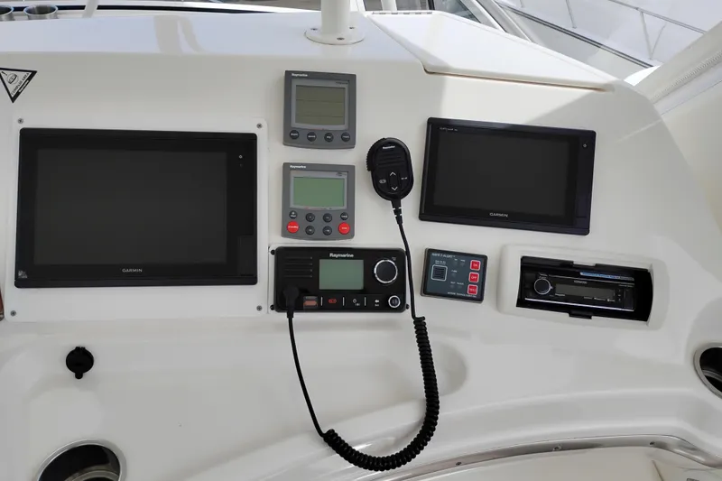 Slide: The Image of Control panel of a 2005 Silverton 38 Convertible boat with navigation equipment. - 26