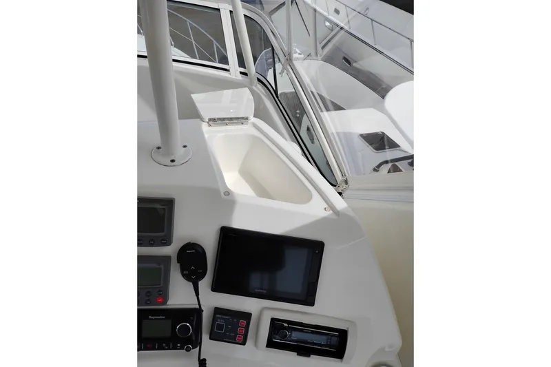 Slide: The Image of 2005 Silverton 38 Convertible yacht helm with navigation equipment and controls. - 29