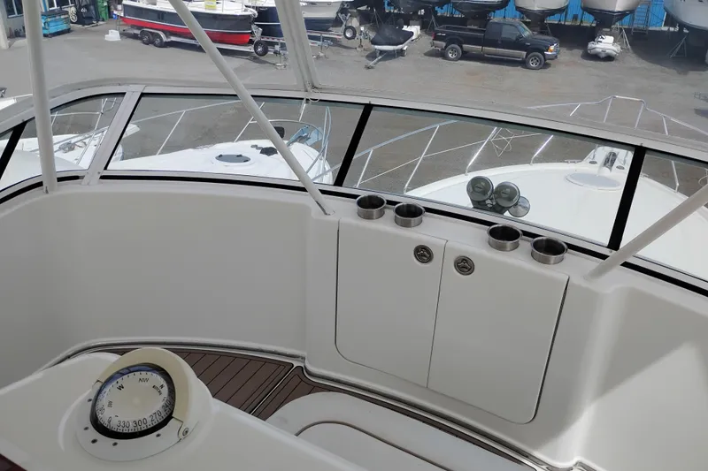 Slide: The Image of 2005 Silverton 38 Convertible yacht cockpit with compass and cup holders. - 30