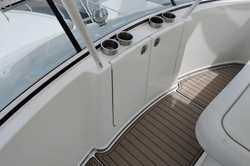 Slide: The Image of 2005 Silverton 38 Convertible boat interior with cup holders and sleek design. - 31